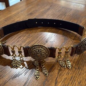 Beautiful Leather belt embellished with gold.  Size small/medium 32” long.